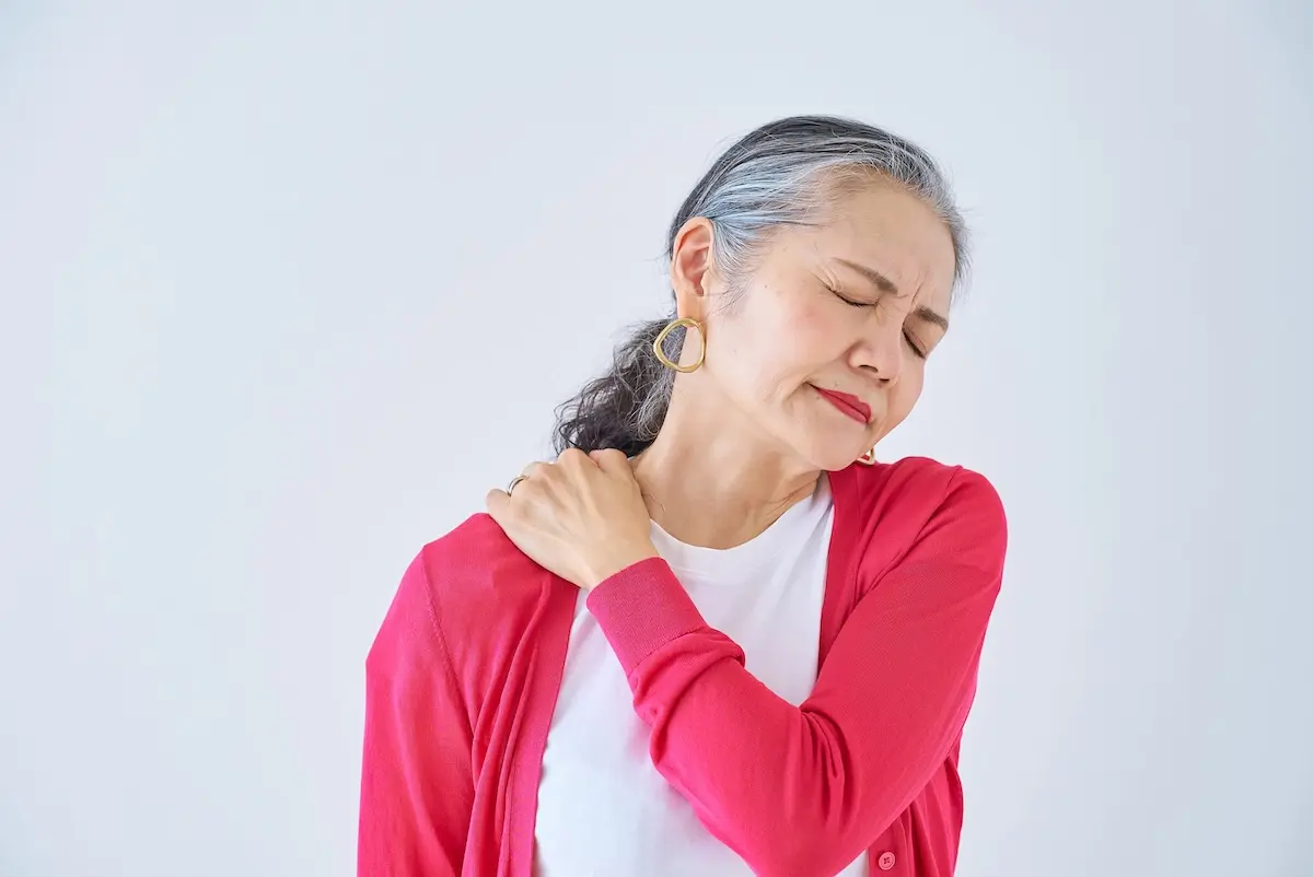 Person holding a mirror over a calm lake, reflecting their face; symbolizes introspection, self-reflection, and exploring inner self-image.